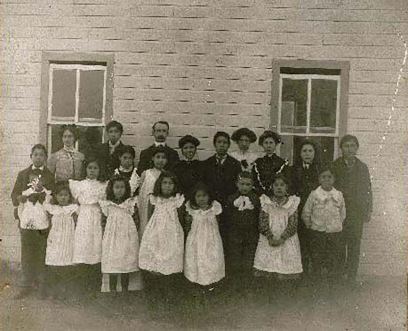 Group of people in front of Fire Hills school