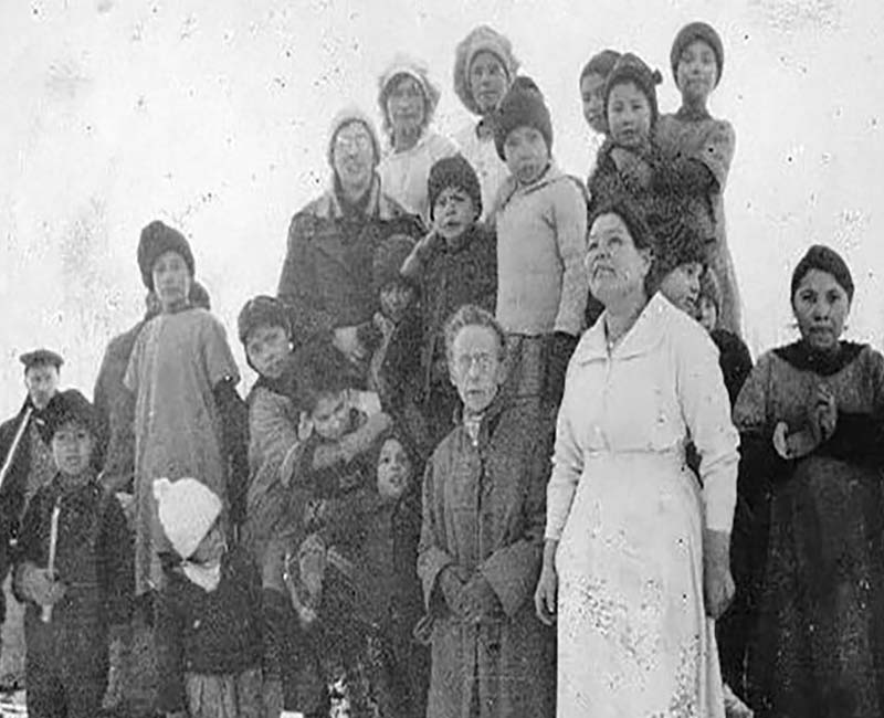 Group of people posing for photo from Lesser Slave Lake school