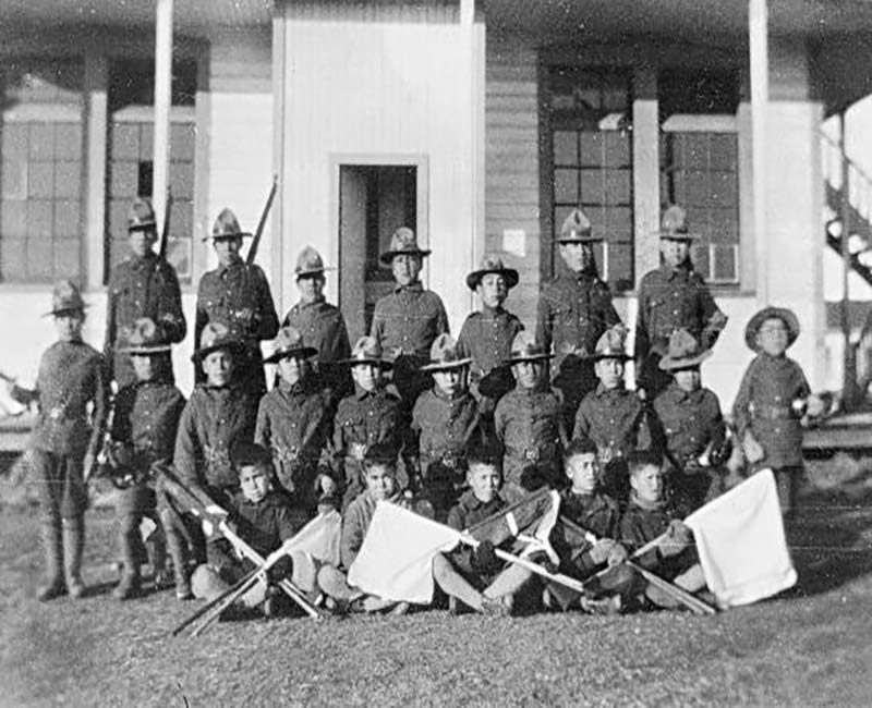 group of people in front of Prince Albert school