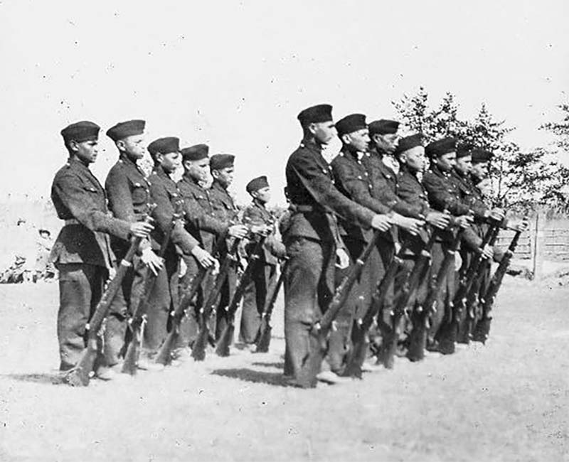 group of people outside of Prince Albert in uniforms 