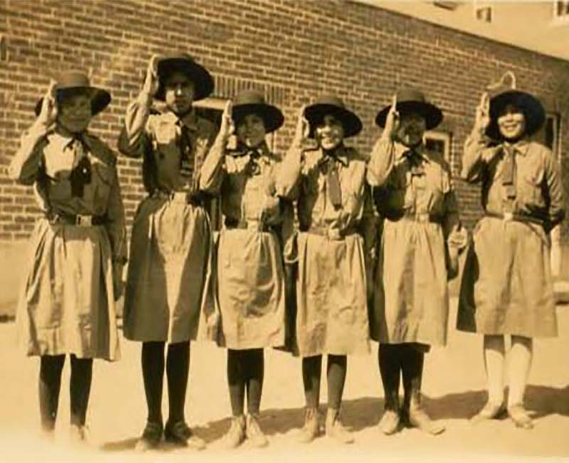 Group of people standing in front of St. Georges school