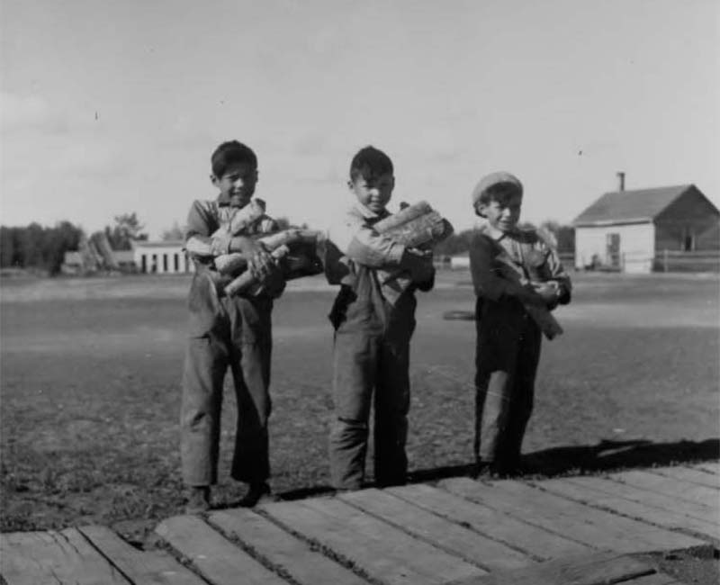 Three students outside at Sturgeon Lake Calais school