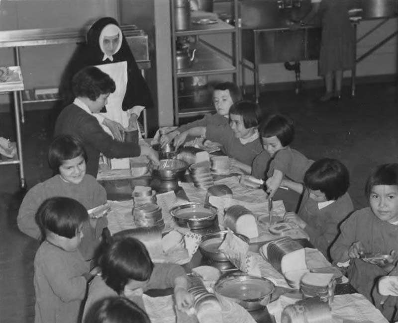 Group of students eating at Amos school 