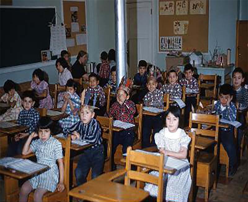 Group of students sitting in rows of desks in Brandon school