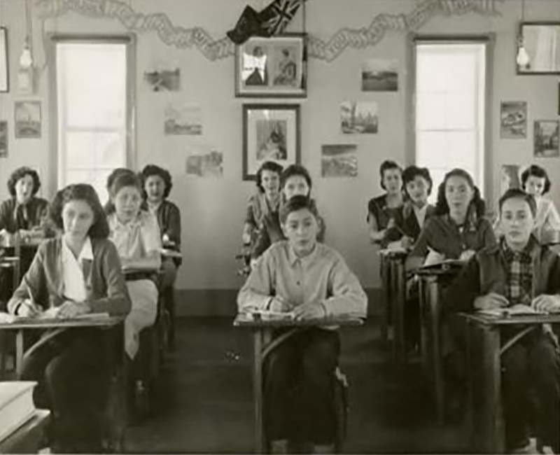 Students sitting at desks in Breynat Hall school