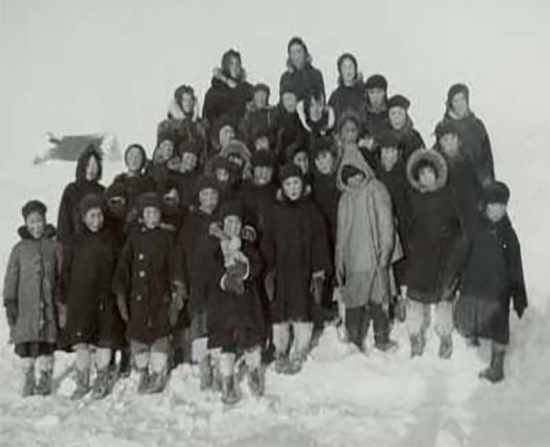 Group of students outside in the snow