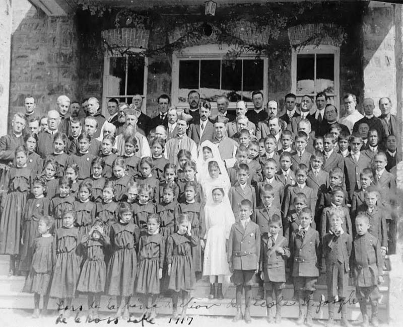 Group of students and teachers in front of Cross Lake school