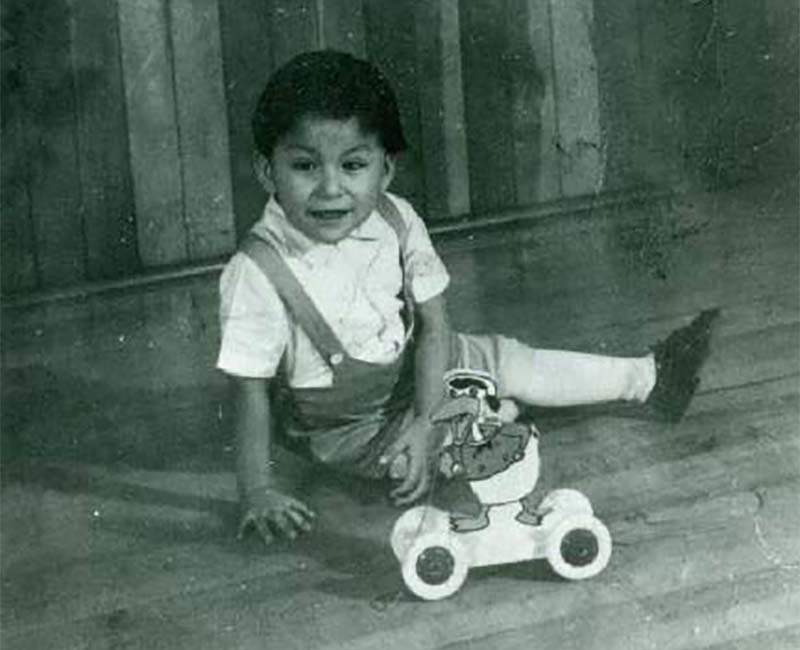 Child playing on floor with toy at McIntosh school