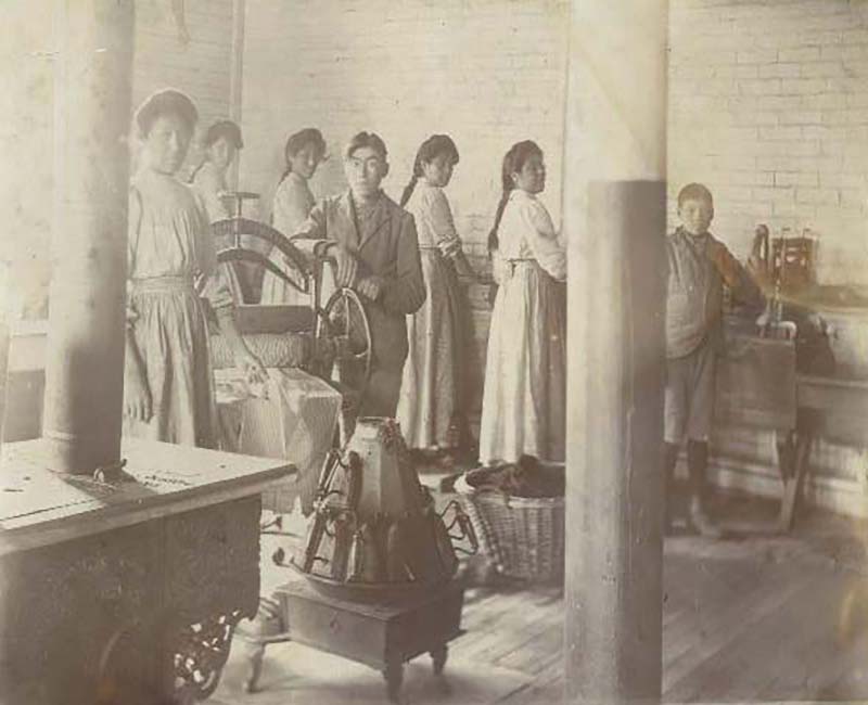 Group of people doing laundry in Mount Elgin school