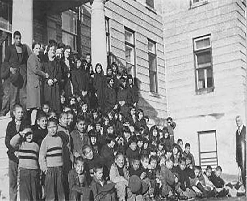 Group of students posed for photo outside Norway House school 