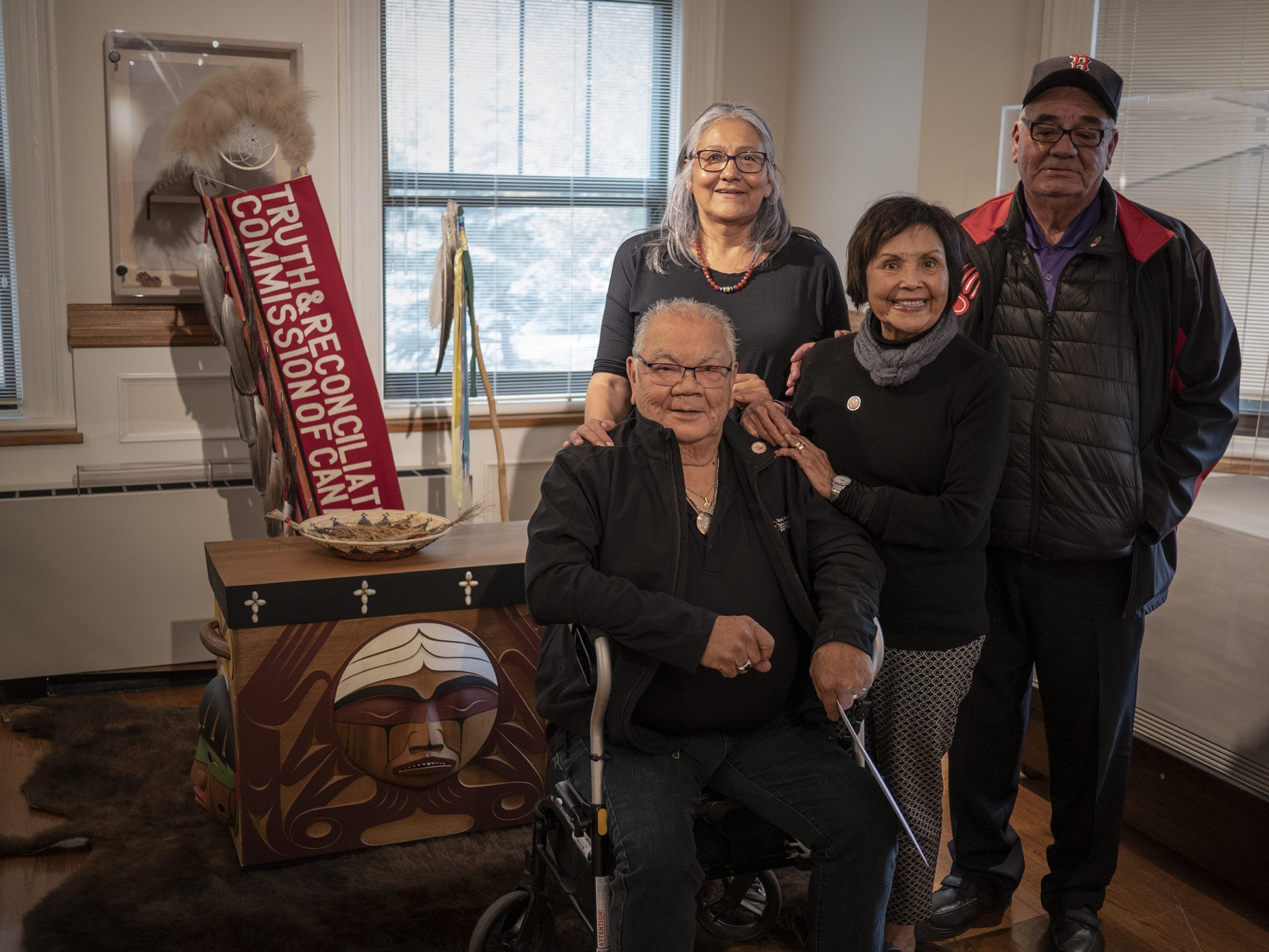 Survivors posing for photo by Bentwood Box