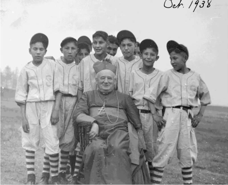 Group of students in baseball outfits from Pine Creek school