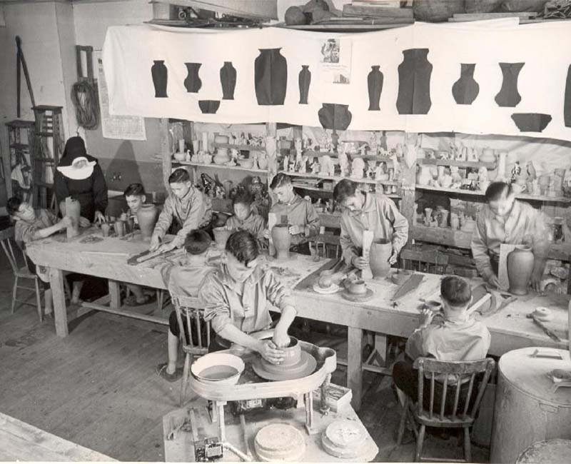 group of people making pottery at Shubenacadie school