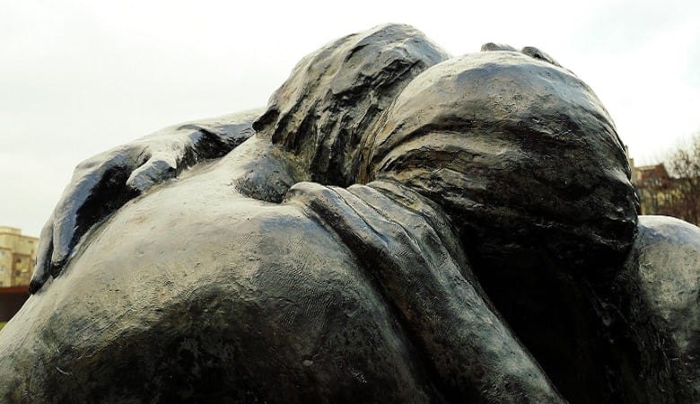 Bronze statues embracing each other